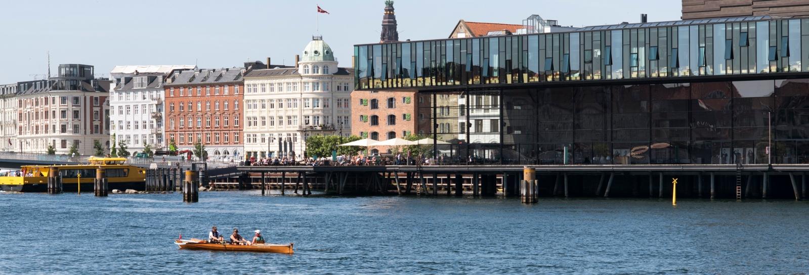 Picture of harbour promenade at Nyhavn with kayak and harbour bus in foreground